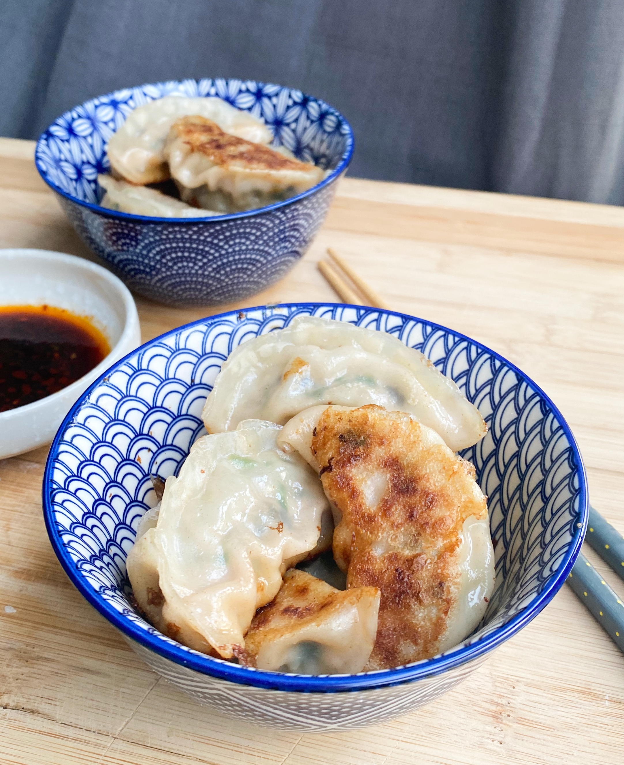 Pork, Shrimp and Chive Dumplings - cooked perfectly with a crispy bottom! Enjoy with a delicious chili soy sauce dipping sauce!